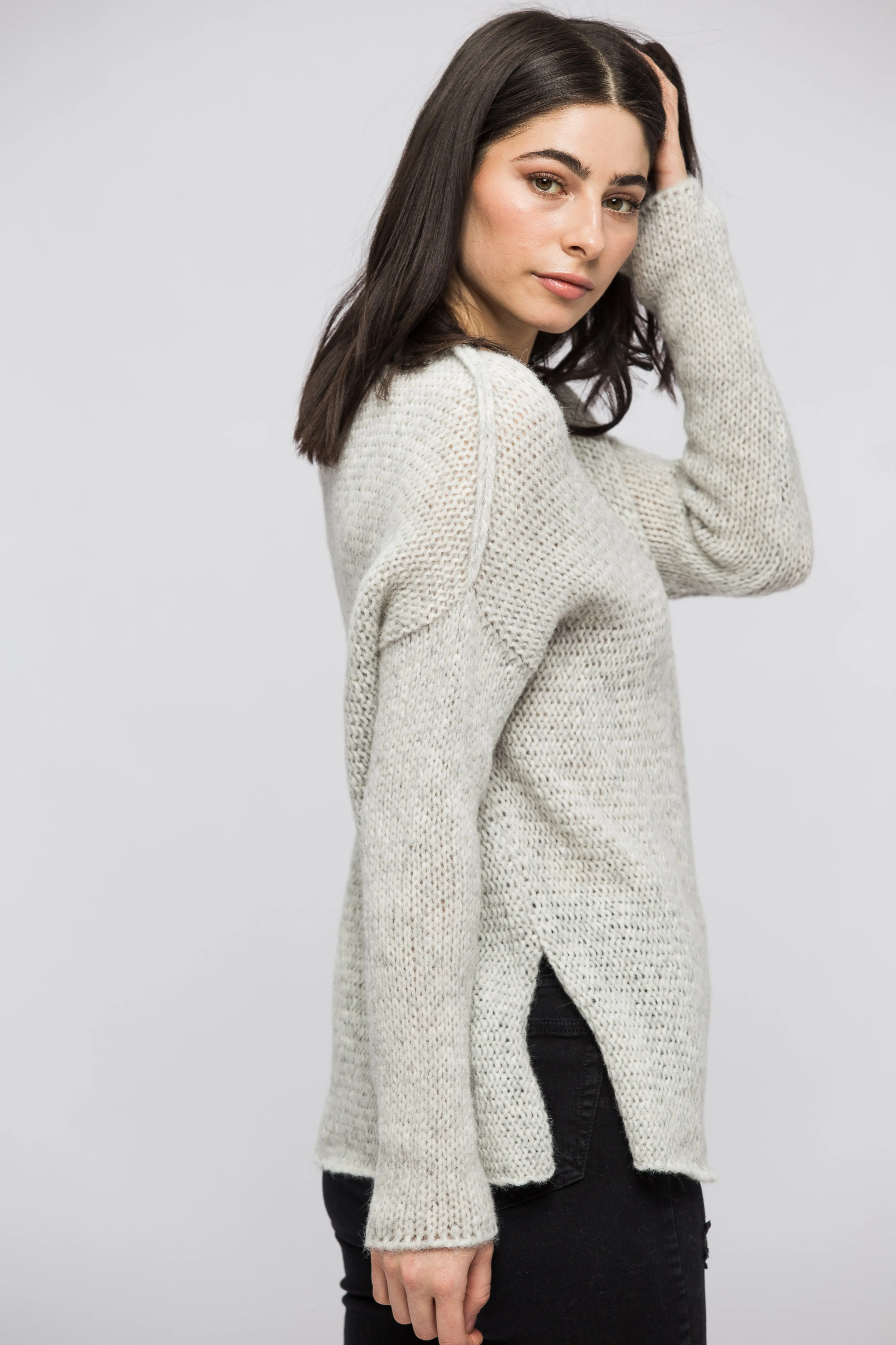 Light grey alpaca sweater.